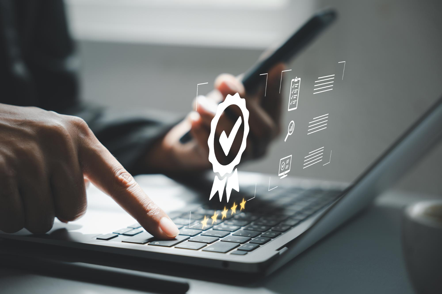 Typing in laptop with 5 start logo